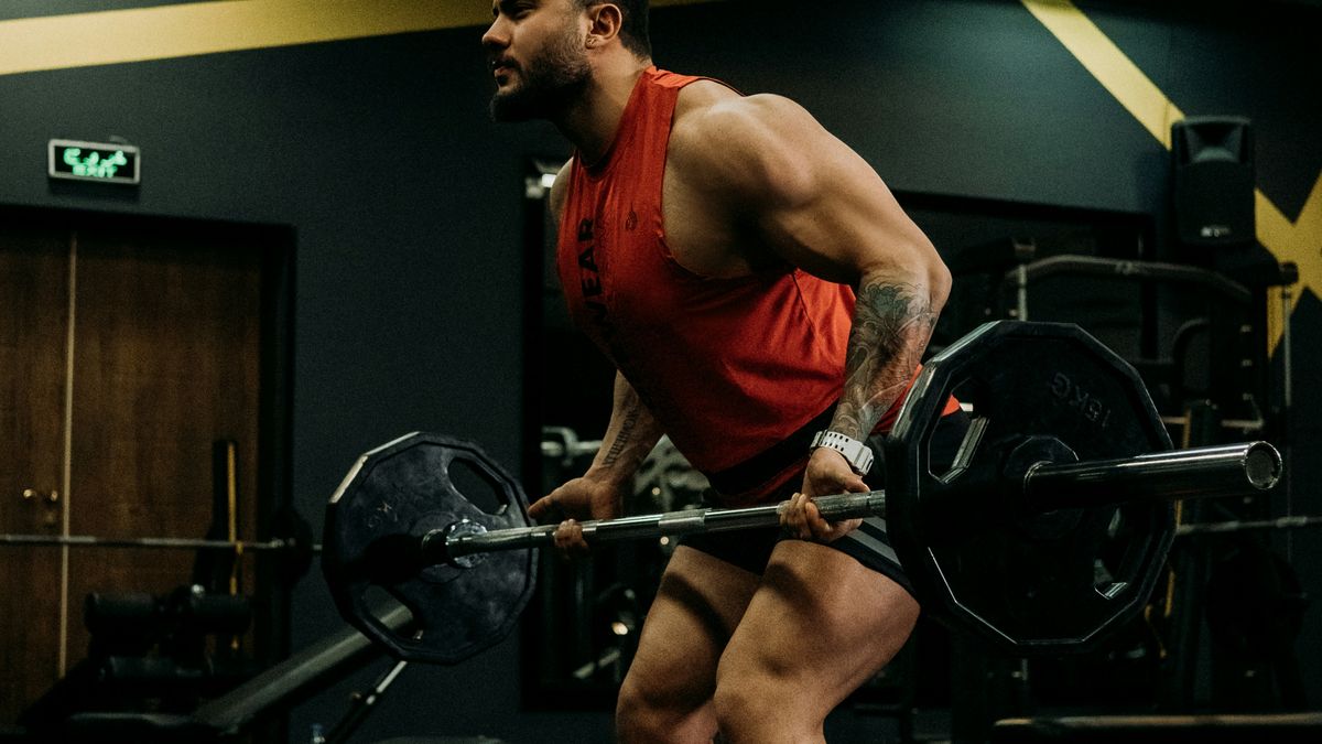 Lifter with a loaded barbell in the gym